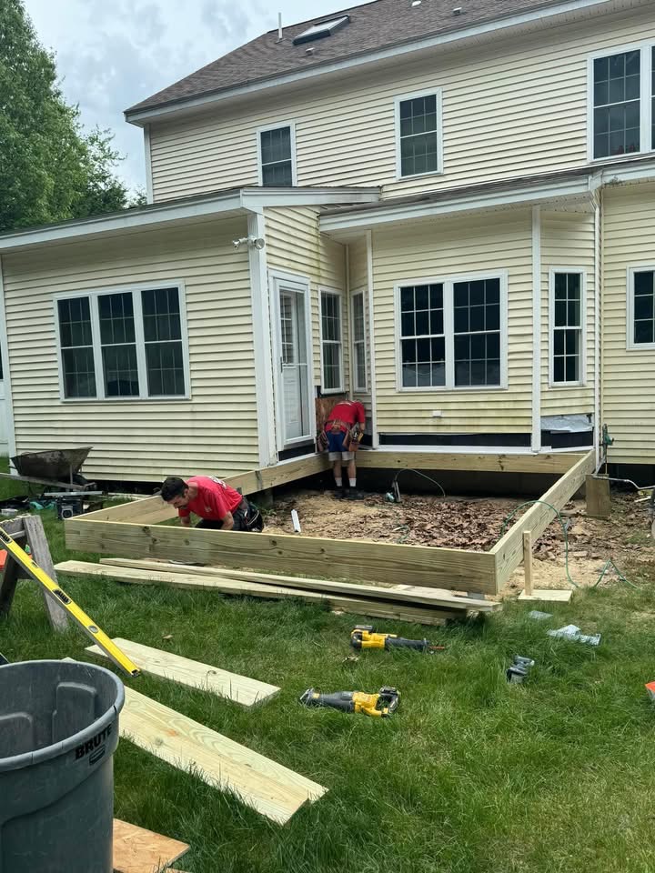 Framing — new pressure-treated frame laid out and squared to the house.