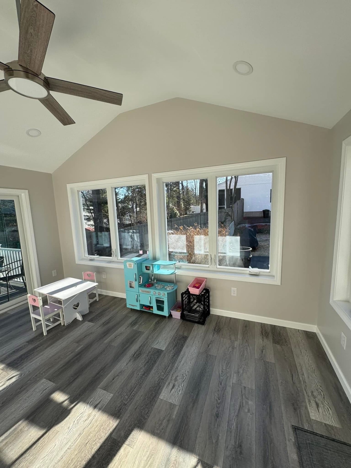 Playroom side of the addition with picture windows overlooking the backyard.